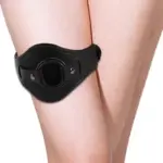 Black adjustable faux leather thigh band with built-in O ring worn on leg for indoor couple use