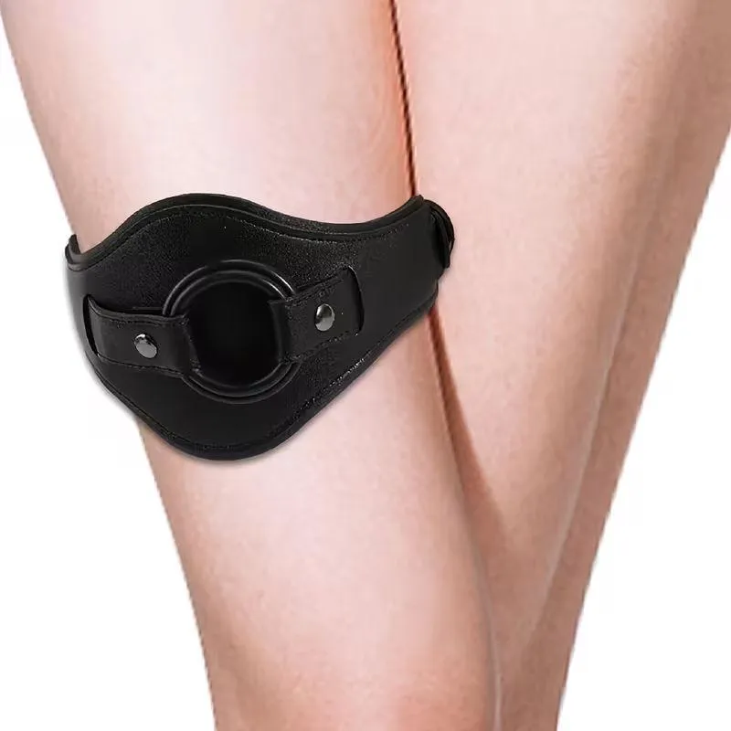 Adjustable Leather Thigh Strap with O-Ring for Couple Bedroom Play Black adjustable faux leather thigh band with built-in O ring worn on leg for indoor couple use