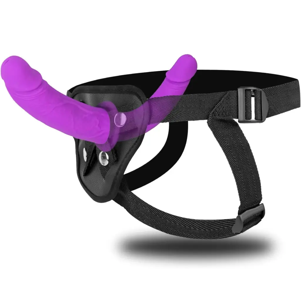 Purple double-ended silicone massager with a black adjustable waist strap on a clean background.