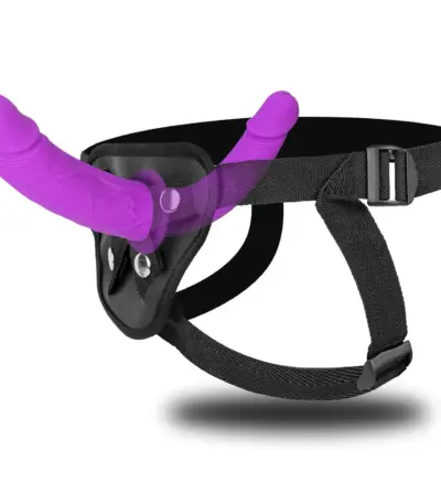 Purple double-ended silicone massager with a black adjustable waist strap on a clean background.